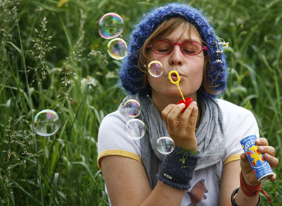 An anti-G8 demonstrator blows soap bubbles during a demonstration against the summit outside the airport Rostock-Laage prior to the arrival of U.S. President George W. Bush, June 5, 2007. The G8 summit will take place in Heiligendamm, about 20 kilometres southwest of Rostock from June 6 till 8.