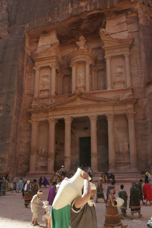 Jordanian men dressed as Nabteans display their goods next to the treasury site in Petra city, during a show for visitors, in this January 16, 2007 file photo. The Great Wall of China, Petra in Jordan and Brazil's statue of Christ the Redeemer have been chosen to be among the modern-day seven Wonders of the World, the organizers of the competition said on July 7, 2007.