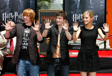 Cast members Daniel Radcliffe (C), Rupert Grint (L) and Emma Watson from the movie 