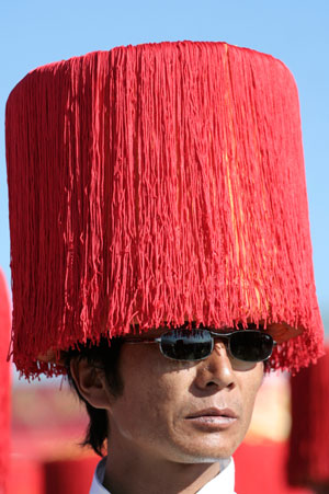 A man wears a traditional hat during the Tibetan Kangba Art Festival in Yushu county, northwest China's Qinghai province July 25, 2007. The five-day art festival provides visitors with folk performances, costume displays and horse racings, local media reported. Picture taken July 25, 2007. 