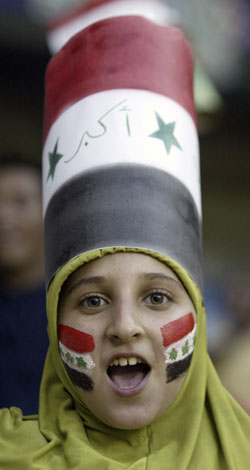 A fan celebrates Iraq's victory over Saudi Arabia after the final match at the 2007 AFC Asian Cup soccer tournament at the Gelora Bung Karno stadium in Jakarta July 29, 2007. 