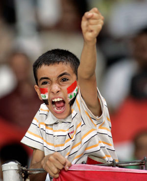 An Iraqi fan cheers during the final match between Saudi Arabia and Iraq at the 2007 AFC Asian Cup soccer tournament at the Gelora Bung Karno stadium in Jakarta July 29, 2007. 