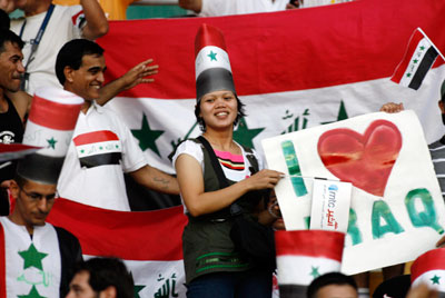 Fans of the Iraqi team smile during the final match between Saudi Arabia and Iraq at the 2007 AFC Asian Cup soccer tournament at the Gelora Bung Karno stadium in Jakarta July 29, 2007.