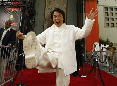 Cast member Jackie Chan throws a kick at the premiere of 