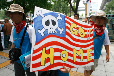 University students carry a placard during an anti-war and anti-U.S. rally demanding negotiations between the U.S. government and the Taliban for the safe return of the South Korean hostages in front of the U.S. embassy in Seoul August 1, 2007. Relatives of South Koreans kidnapped in Afghanistan and the nation's lawmakers pleaded with Washington on Wednesday to intervene and help secure the release of 21 held by Taliban insurgents and believed to be still alive.