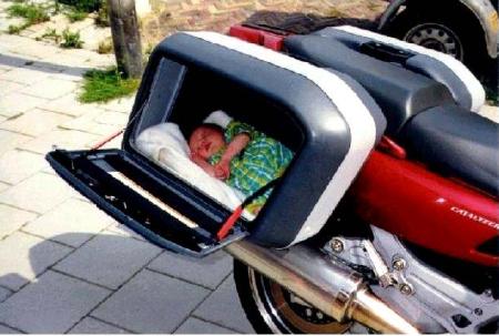 Cute baby sleeping in motor bike