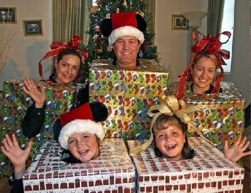 The best of all gifts around any Christmas tree is the presence of a happy family all wrapped up in each other.