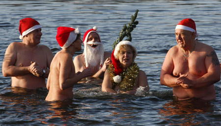 Santas go for ice swimming