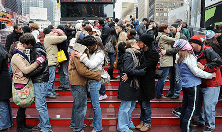 Couples practice kissing for New Year's Eve celebration