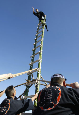 Japanese firefighters show off pole dancing skills