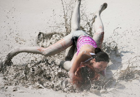 Mud and guts in women's mud wrestling contest