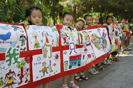 Nursery pupils on green catwalk show