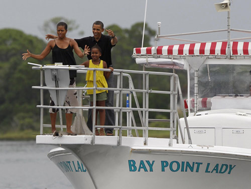 Obama swims, takes boat ride during Gulf Coast vacation