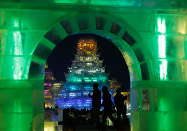 Ice sculptures shine at night in Harbin