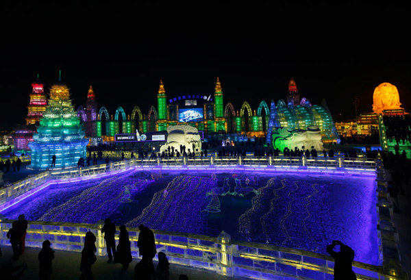 Ice sculptures shine at night in Harbin