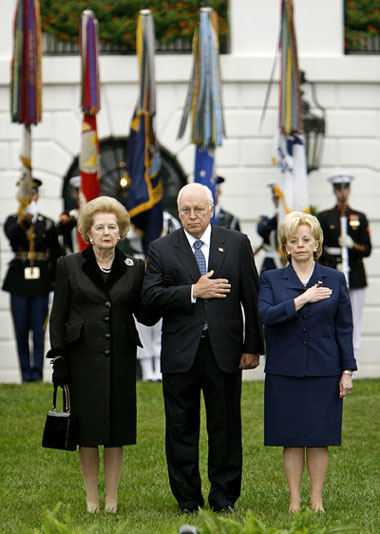 U.S. Vice President Dick Cheney stands with former British Prime Minister Margaret Thatcher (L) and his wife Lynne (R) during the playing of the U.S. National Anthem at ceremonies in memory of the victims of the September 11 attacks for members of the Bush administration and White House staff on the South Lawn of the White House in Washington, September 11, 2006.