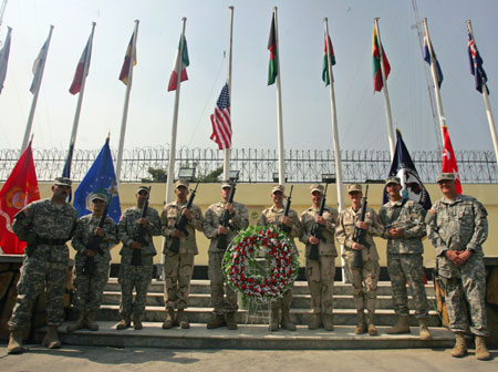 U.S. army personnel pose during a ceremony n Kabul September 11, 2006, to commemorate the fifth anniversary of the September 11, 2001 attacks.