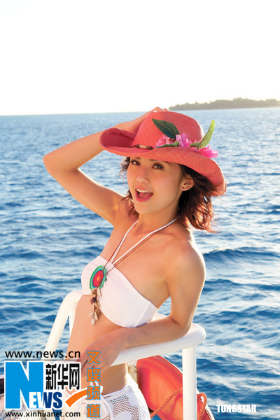 Charlene Choi poses in bikini when shooting the music videos and cover photo for their latest Cantonese album "Ho Hoo Tan" on Saipan Island, United States. 