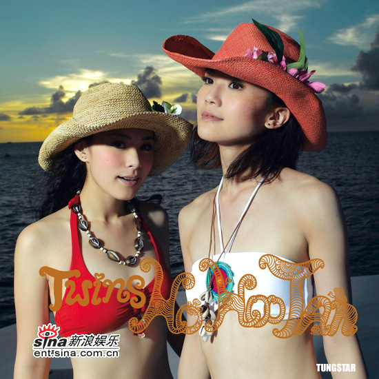 Hong Kong super pop duo Twins poses in bikini when shooting the music videos and cover photo for their latest Cantonese album "Ho Hoo Tan" on Saipan Island, United States.