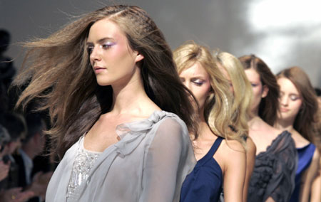 Models display outfits as part of Alberta Ferretti's Spring/Summer 2007 women's collections during Milan Fashion Week September 27, 2006. 