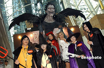 Citizens wear scary costumes to celebrate the forthcoming Halloween Festival in a shopping mall of Hong Kong, Tuesday, Oct. 24, 2006. Halloween is celebrated on the night of Oct. 31.