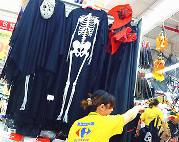 Halloween costumes are on sale at a store in Shanghai on October 23, 2006. Halloween, a festival in Europe and North America and celebrated on the night of October 31, is becoming increasingly popular in China.