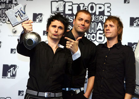 Dominic Howard, Matthew Bellamy and Chris Wolstenholme of Muse, winners of the Best Alternative Award, pose at the13th Annual MTV Europe Music Awards 2006 show in Bella Center in Copenhagen, November 2, 2006.