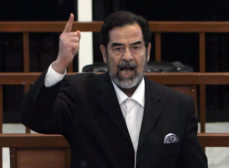 Former Iraqi president Saddam Hussein yells at the court as he receives his verdict during his trial held under tight security in Baghdad's heavily fortified Green Zone November 5, 2006. A U.S.-backed Iraqi court on Sunday sentenced toppled leader Saddam Hussein to death by hanging for crimes against humanity.