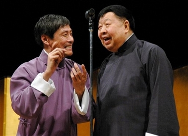 In this photo released by China's Xinhua news agency, Ma Ji, right, performs at a show in Tokyo on April 15, 2006.