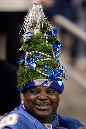 Detroit Lions fan Joe T. Sanders wears a Christmas tree hat during the Christmas eve NFL football game against the Chicago Bears in Detroit, Michigan December 24, 2006.
