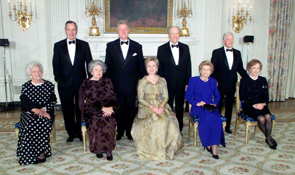 U.S. President Bill Clinton (rear row, 2nd L) poses with former Presidents George Bush (rear row L), Gerald Ford (rear row 2nd R) and Jimmy Carter (rear row R) and first ladies, past and present, Barbara Bush (front row L), Lady Bird Johnson (front row 2nd L), Hillary Rodham Clinton (front row C), Betty Ford (front row 2nd R) and Rosalynn Carter (front row R) in the State Dining Room of the White House in Washington in this November 9, 2000 file photo. Clinton and the former presidents celebrated the 200th anniversary of the White House. Ford, who took office from an embattled Richard M. Nixon, has died, according to a statement from his widow on December 26, 2006.