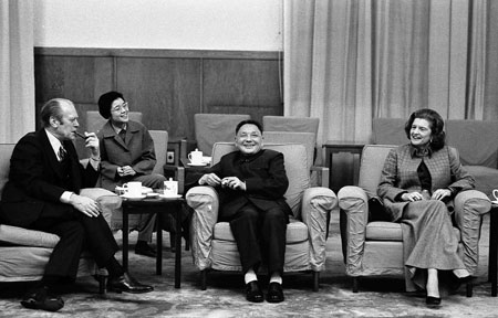 Former U.S. President Gerald Ford (L) and his wife Betty (R) is pictured with Vice Premier Deng XiaoPing (C) and Deng's interpreter (2nd L) having a chat during an informal meeting in Peking, China in this December 3, 1975 file photo. Ford, 93, has died, according to a statement from his wife Bette on December 26, 2006.