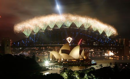 Fireworks explode over the Sydney Opera House and Harbour Bridge during New Year's celebrations January 1, 2007. The celebrations, costing around A$4 million and including 3,000 kilograms of explosives and pyrotechnics, are called 
