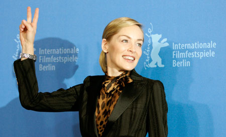 U.S. actress Sharon Stone flashes a victory sign during a photocall to present her film 'When A Man Falls In The Forest' running in competition at the 57th Berlinale International Film Festival in Berlin February 12, 2007. The festival runs from February 8-18.