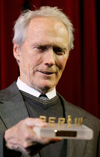 U.S director Clint Eastwood holds the special award trophy 'Ehrenkammera' (camara of honour) before the screening of the film 'Letters From Iwo Jima' running in competition at the 57th Berlinale International Film Festival in Berlin February 11, 2007.