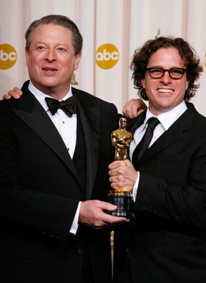Former Vice President Al Gore (L) and Davis Guggenheim, winners of Best Documentary Feature for 