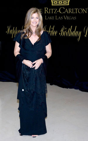 Model and designer Kathy Ireland poses as she arrives for Elizabeth Taylor's 75th birthday party at the Ritz-Carlton, Lake Las Vegas in Henderson, Nevada February 27, 2007.