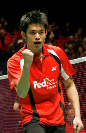 China's Lin Dan celebrates beating China's Chen Yu during the men's single final match at the All England badminton championships in Birmingham, England March 11, 2007.