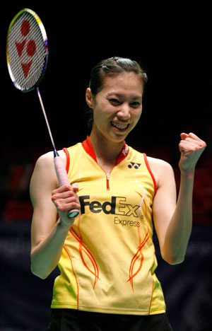 China's Xie Xingfang celebrates beating France's Pi Hongyan during the women's singles final at the All England badminton championships in Birmingham, England March 11, 2007. 