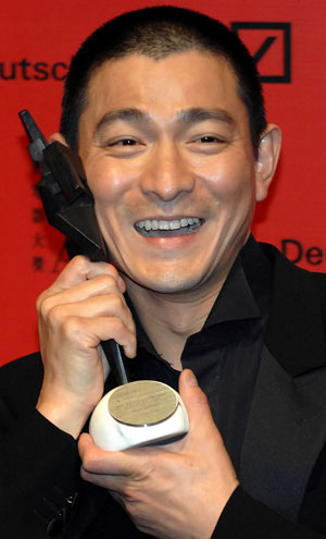 Hong Kong actor Andy Lau holds his 