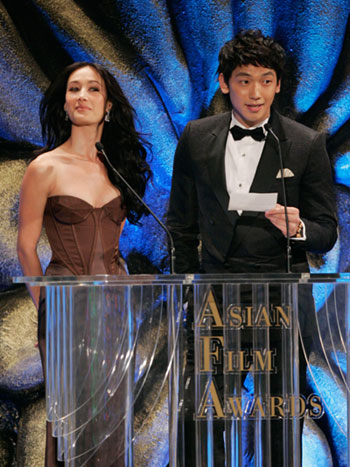Actress Maggie Q (L) and South Korean actor Rain attend the Asian Film Awards, a part of the Entertainment Expo Hong Kong, in Hong Kong March 20, 2007.