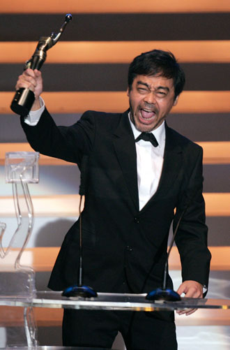 Actor Lau Ching Wan reacts after winning the Best Actor Award for the movie 