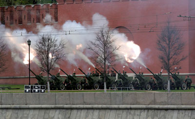 Artillery guns fire from the foot of the Kremlin wall during World War Two victory celebrations in Moscow May 9, 2007. 