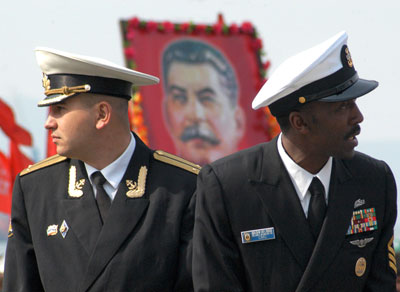 Officers from the U.S. Navy's guided missile destroyer, John S. McCain, attend World War Two victory celebrations in the far-eastern city of Vladivostok May 9, 2007. Russia celebrated on Wednesday the 62nd anniversary of the World War Two victory over Nazi Germany. Crew members of the U.S. destroyer John S McCain celebrated together with Russian sailors, the Interfax news agency reported.
