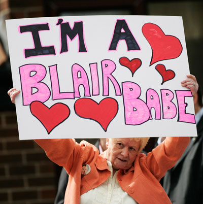 A Blair supporter holds a banner while waiting for the arrival of Prime Minister Tony Blair at Trimdon Labour Club in Trimdon, northeast England May 10, 2007.
