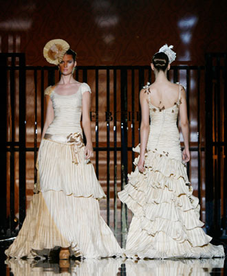 Models present creations from Pepe Botella collection at Barcelona Bridal Week fashion show May 31, 2007.