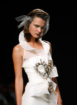 A model presents a creation from the Jesus Peiro collection at the Barcelona Bridal Week fashion show May 30, 2007.
