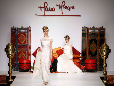 A model presents a creation from the Maria Alegre collection at the Barcelona Bridal Week fashion show May 30, 2007.