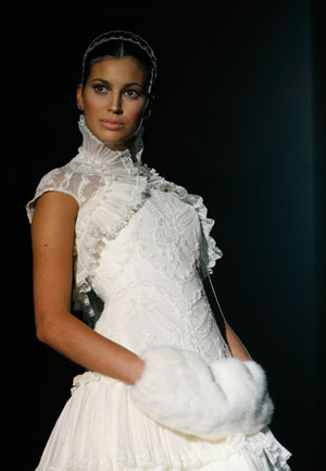 A model presents a creation from Pepe Botella collection at Barcelona Bridal Week fashion show May 31, 2007.
