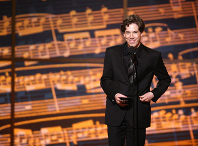 Actor John Gallagher Jr. speaks after receiving the award for Best Performance by a Featured Actor in a Musical for his work in 